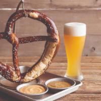 German Pretzel · A giant Bavarian pretzel as big as your head, baked soft on the inside, crispy on the outsid...