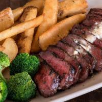 Steak Frites* · Marinated flat-iron steak grilled & thinly sliced, topped with garlic butter & served with s...