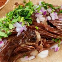 Barbacoa Taco · Barbacoa, chopped red onion and fresh cilantro