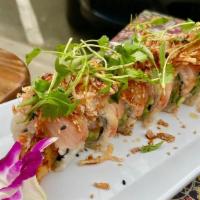 Dirty Blonde Roll · Shrimp tempura, spicy crab, avocado, cucumber, layered with yellowtail, crispy red onions, m...