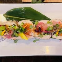 Ex Lover Roll · Yellowtail, salmon, crab salad, avocado, cucumber wrapped in soy paper no rice, garnished wi...