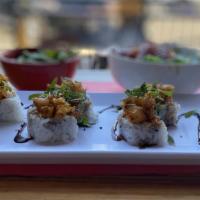 Dank Roll · Spicy crab salad, avocado, cream cheese, topped with sweet and spicy shrimp tempura, cilantr...