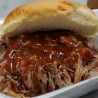 Brisket Sandwich · Smokey and savory chopped brisket on a bun. Served with any sauce of your choice.