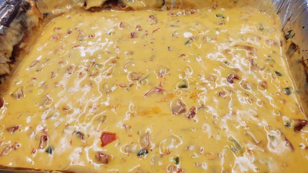 Smoked Queso · 2 oz. Added to any menu item