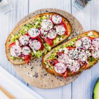 Avo Toast · Multigrain bread topped with avocado, crumbled feta, olive oil, local organic tomatoes, blac...
