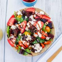 Goat Cheese · Organic baby spinach, purple and golden beets, goat cheese, strawberry slices, balsamic glaz...
