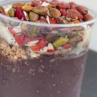 Shores · Acai with banana and almond milk topped with banana, strawberry, granola, shredded almonds, ...