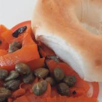 V-Lox Bagel · Toasted bagel with our homemade v-cream cheese  
 & Carrot lox, onions, tomatoes and capers