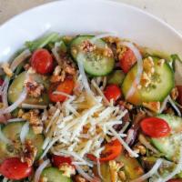 Lancaster Salad · Cherry tomatoes, cucumbers, onions, walnuts, v-cheese, organic spring mix, with Raspberry Vi...