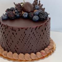 Cheesecake Delight · Serves six to eight. Chocolate cake with chocolate mousse and ganache, raspberry mousse, che...