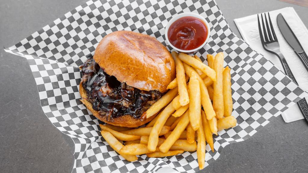 Korean Pulled Pork Sandwich With French Fries · Homemade pulled pork with a spicy Korean BBQ sauce.
served on a country bun with French fries