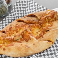 Steak Stromboli · Steak, peppers, onions, cheese and sauce.