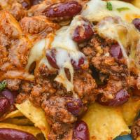 Ground Beef Nachos · Comes with pickled jalapeños.