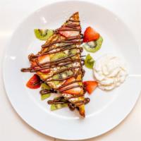 French Toast · French toast with Nutella  and topped with fresh fruit and whipped cream