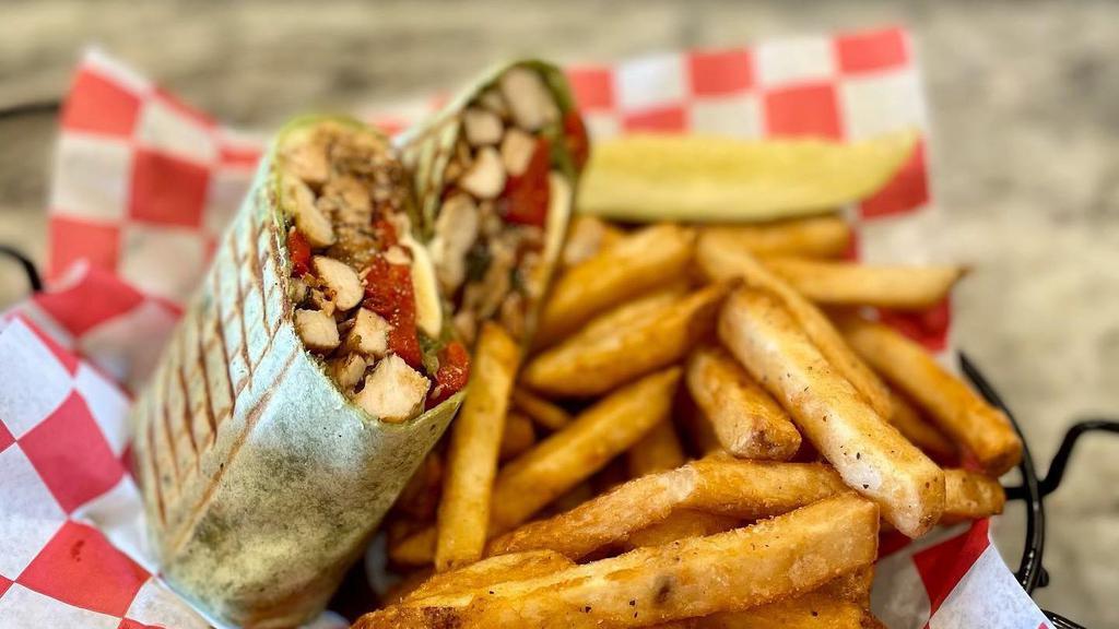 Italiano Wrap · Grilled chicken, roasted peppers, fresh mozzarella and balsamic glaze.