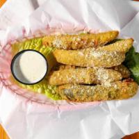 Fried Pickles · Breaded and deep fried dill pickle spears served with ranch.