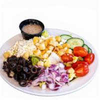 Greek Salad · Romaine lettuce, feta, grape tomatoes, cucumbers, onions, Kalamata, and Greek dressing.