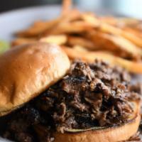 Brisket Sandwich · Chopped Prime brisket served on a toasted brioche bun; served with your choice of side.