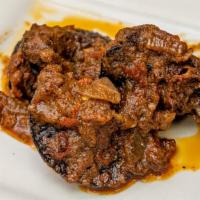 Snails · Seasoned African snails in spicy tomato sauce sauteed with onions & peppers.
