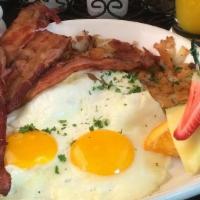 Three Egg Breakfast · with choice of bacon, banger sausage (contains gluten), or turkey kielbasa, hash brown potat...