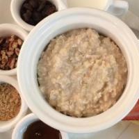 Oatmeal & Toasted Pecans · served with a side of milk, maple syrup, brown sugar, and raisins