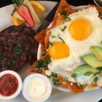 Spice-Rubbed Rib Eye Steak Chilaquiles · ribeye steak, ranchero chips, rojas sauce, refried beans, cheddar & cotija cheese, two eggs ...