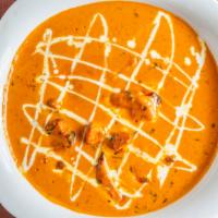 Butter Chicken · Marinated Grilled boneless cubes cooked in tomato sauce and butter with cream (1 Naan)