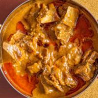 Goat Korma · Bone in cooked in thick curry sauce (1 Naan)