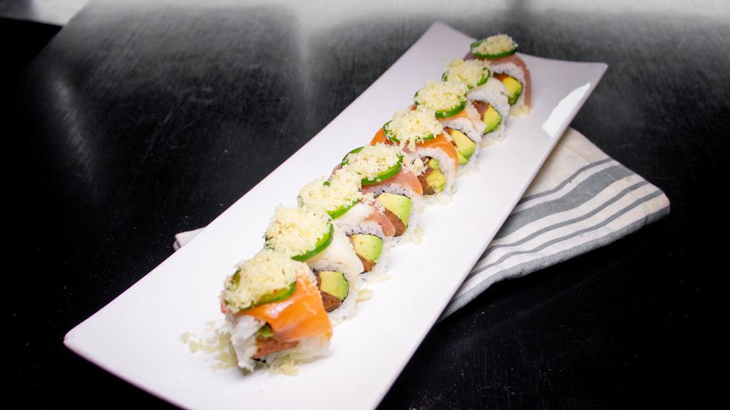Pacific · Spicy tuna and avocado topped with salmon tuna escolar jalapeño and crunch.