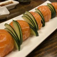 Salmon Cannon Ball · Crab mix, crunch, masago, spicy tuna inside wrap with fresh salmon.