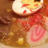 Nabeyaki Udon · Japanese noodle soup with shrimp tempura, chicken, egg, fish cake and vegetables.