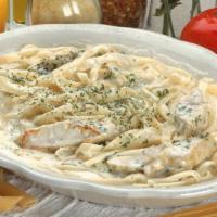 Fettuccine Alfredo With Chicken · Fettuccine noodles tossed with our cream and romano cheese sauce.