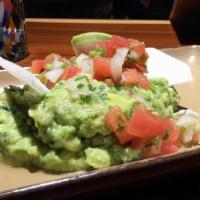 Guacamole · Chunky aguacate, lima, cilantro, chips de chile serrano toppings: piña chipotle, mango-haban...