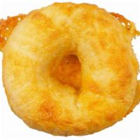 Cheddar Cheese Bagel · Thick slice of real cheddar cheese melted on a plain bagel. Our real cheese bagels are almos...