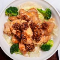 Walnut Delight · Jumbo shrimp and chicken tender chunks in a creamy Marnier sauce with honey walnuts surround...