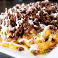 Carne Asada Loaded Fries · Fresh cut fries topped with mozzarella cheese, creamy valveeta nacho cheese, pico de gallo, ...