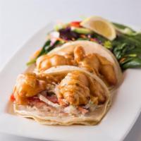 Gulf Coast Shrimp Tacos · Two corn tortillas stuffed with fried Gulf shrimp, zesty coleslaw and chipotle-lime sauce, s...