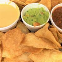 Classic Dip Trio · Fresh made corn tortilla chips with Queso Blanco, Red Salsa and Guacamole
