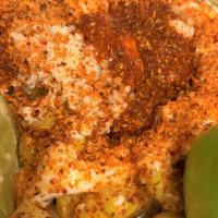 Street Corn In A Cup · Roasted Corn in butter, topped with queso fresco, mayonnaise, Tajin, chile Valentina, and li...