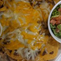 Nachos Compuestos · Fresh tortilla chips with refried beans, cheese, diced tomatoes, chopped lettuce, sour cream...