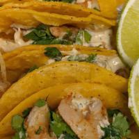 Mini Shrimp Tacos · 5 Mini corn tortillas filled sautéed shrimp drizzled with Chipotle lime dressing, garnished ...