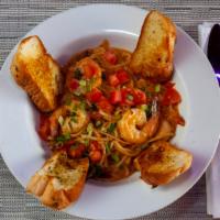 Cajun Shrimp Pasta · Babylon's signature dish. Classic fettuccine pasta and alfredo sauce, sparked with Cajun spi...