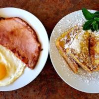 French Toast Combo · Two slices french toast, two eggs, choice of ham, bacon (4), or link sausage (4).