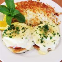 Eggs Benedict · Two poached eggs with ham on a toasted English muffin, Hollandaise sauce. All items are serv...