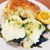 Eggs Florentine · Two poached eggs with thinly sliced breast of turkey and spinach on a toasted English muffin...