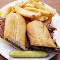 French Dip Sandwich · Hot roast beef, au jus, served on a grilled french roll. Served with potato salad, cole slaw...
