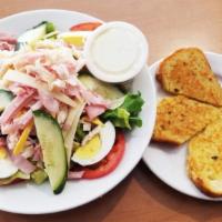 Chef’S Salad · Chilled fresh lettuce topped with slices of ham, roasted turkey breast, hard boiled egg, tom...