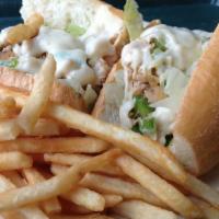 Chicken Cheese Steak · Served hot. Thinly sliced all natural chicken sautéed with onions and finished with melted P...