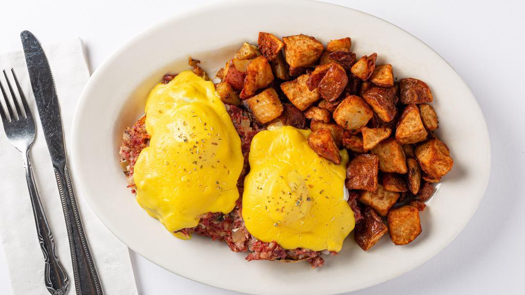 Traditional Eggs Benedict · Traditional eggs benedict with Canadian bacon served over toasted English muffin and home fries or a cup of fruit.