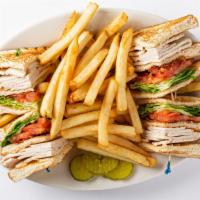 Club Sandwich · Choice of turkey, tuna salad, chicken salad or ham.
